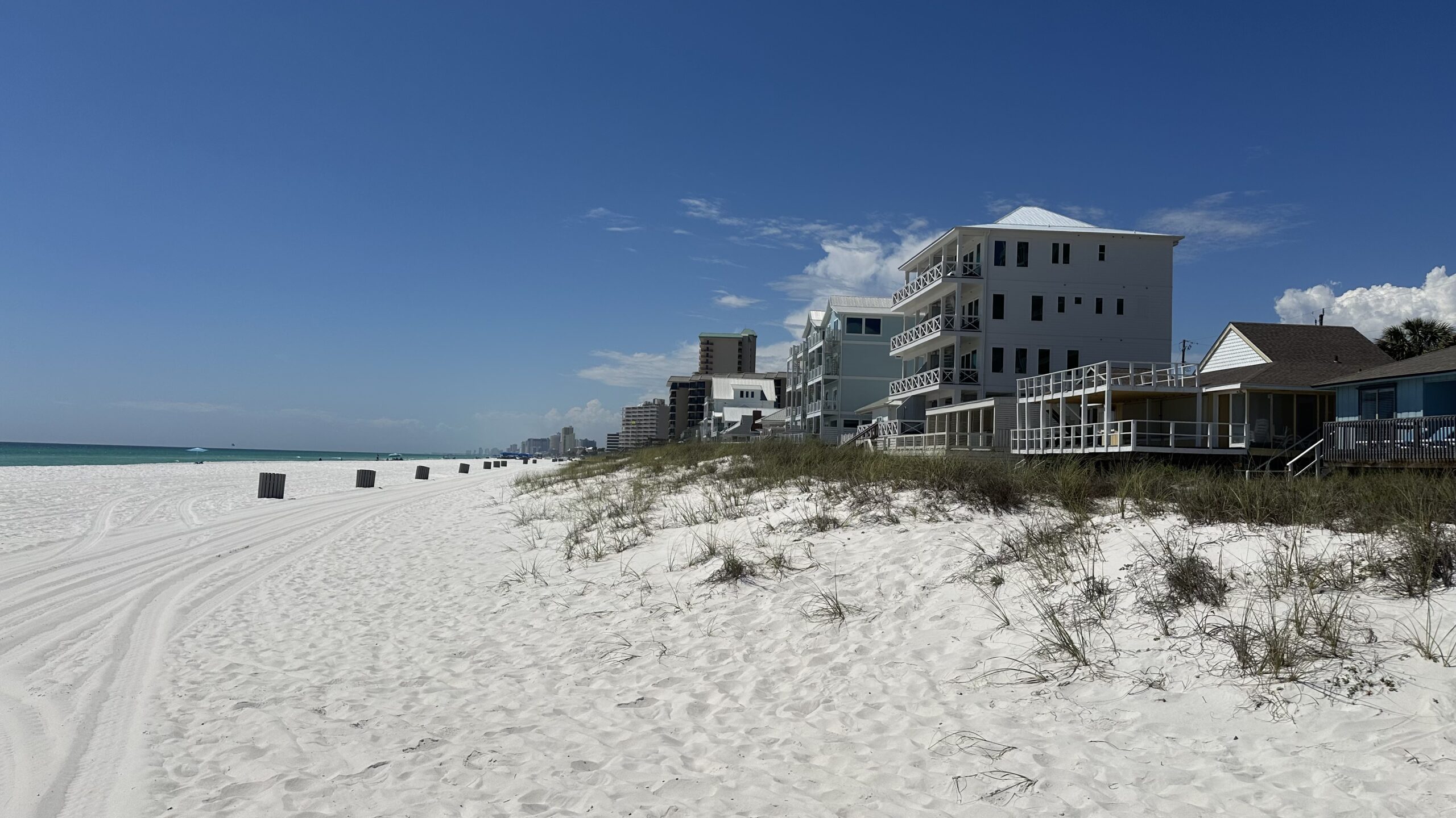 Short-term vacation rental properties along the white sand beachfront in Panama City Beach Florida